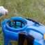 Pouring herbicide into a spray container.